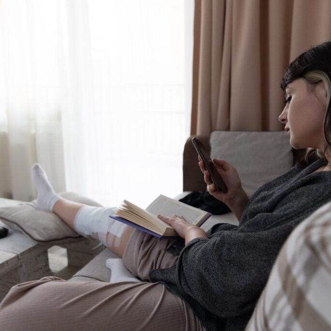 Relaxation,Moment,With,A,Young,Woman,Sitting,On,The,Couch