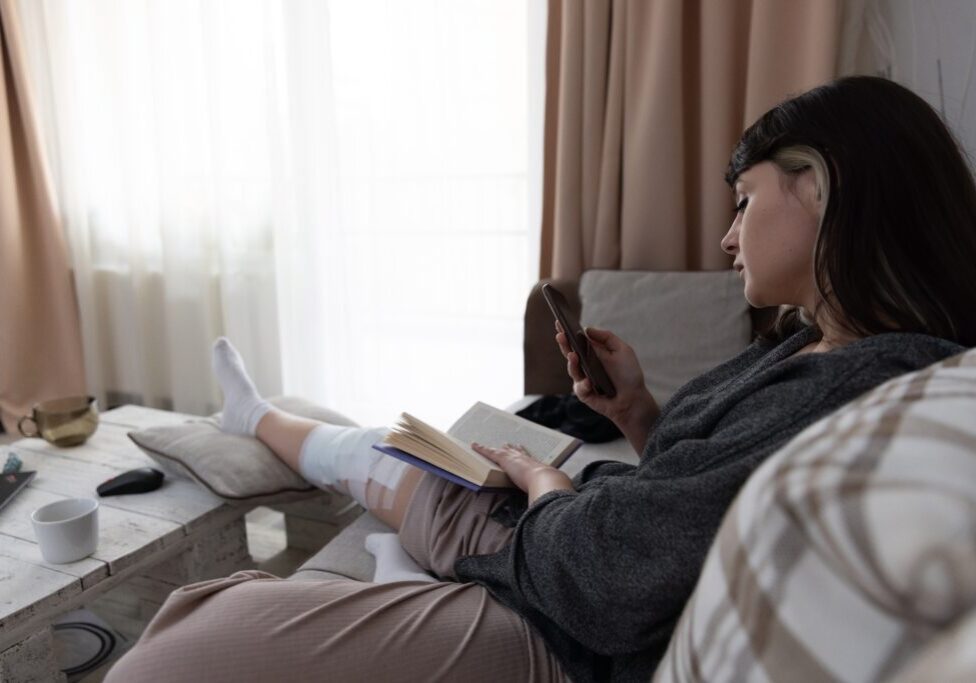 Relaxation,Moment,With,A,Young,Woman,Sitting,On,The,Couch